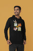 First image of a male model wearing a black hoodie with a large Looney Tunes design. The illustration features portraits of several iconic Looney Tunes characters.