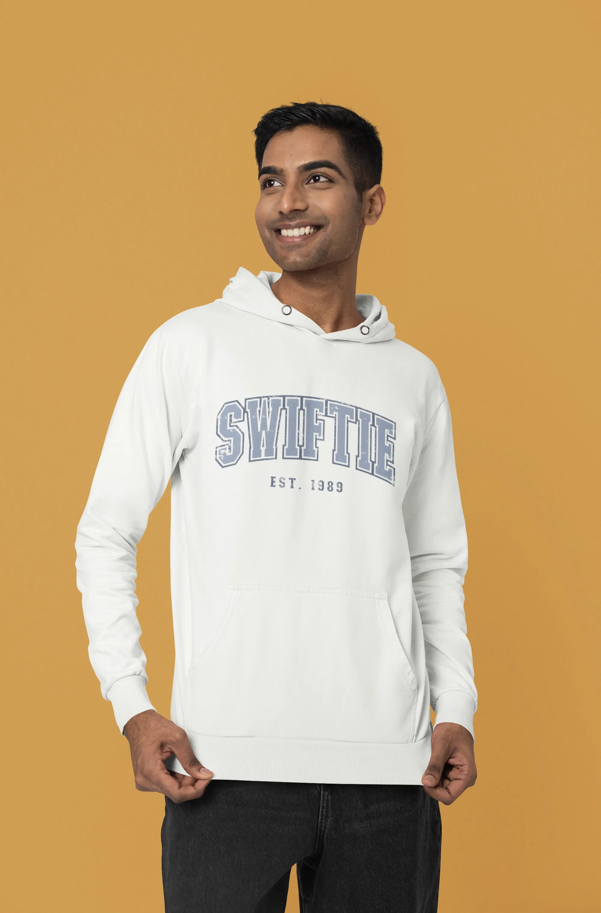 Side view of a male Model wearing an off-white Swiftie hoodie, perfect for Taylor Swift fans and Eras Tour enthusiasts.