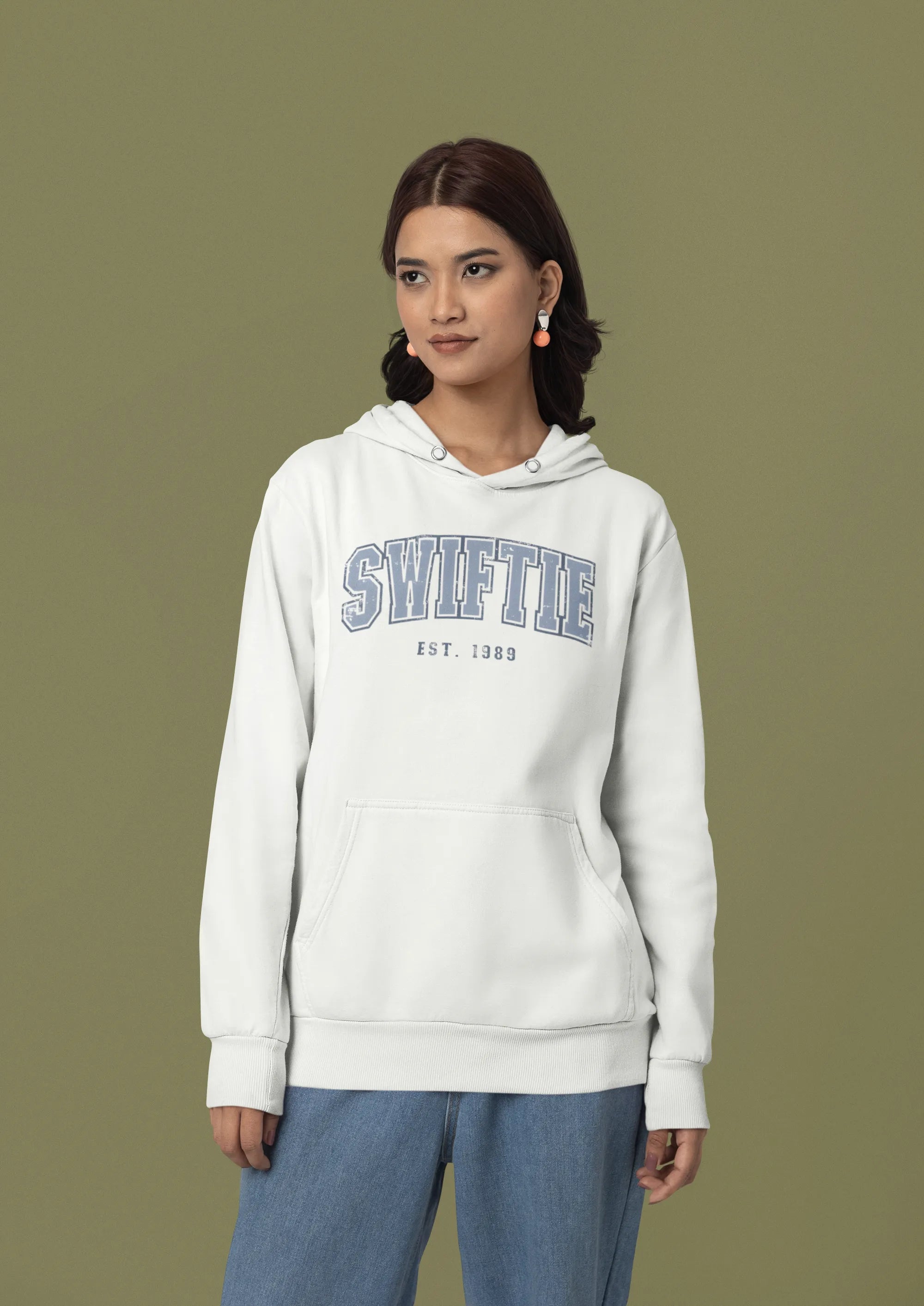 Second front view of a female Model wearing an off-white Swiftie hoodie, perfect for Taylor Swift fans and Eras Tour enthusiasts.