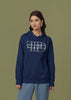 First front view of a female model wearing a navy blue oversized, cozy hoodie featuring 