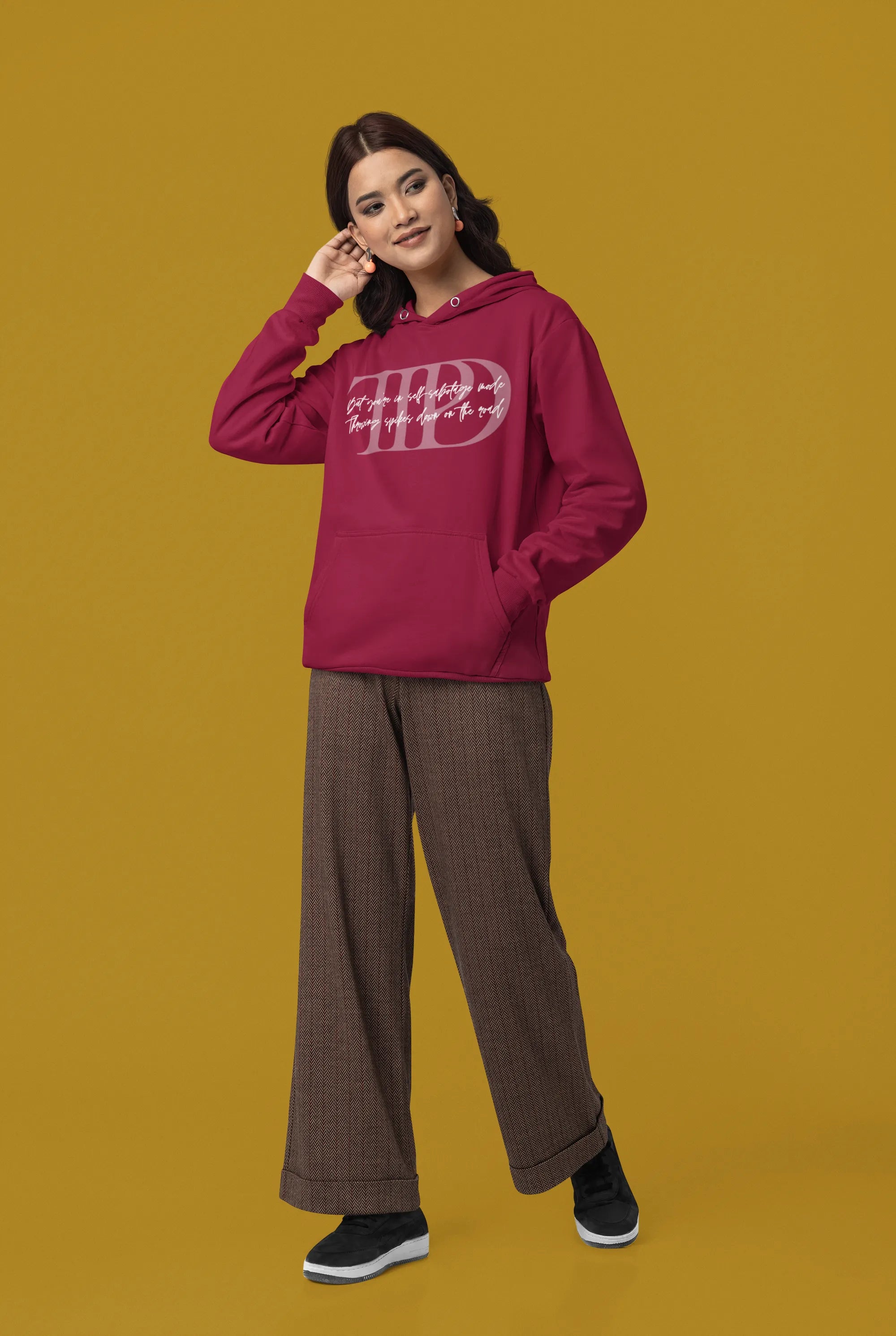  Side view of a female model wearing a maroon oversized, cozy hoodie featuring "Lamenting" lyrics from Taylor Swift's TTPD era. Perfect for Swifties looking for comfortable Eras Tour merch.