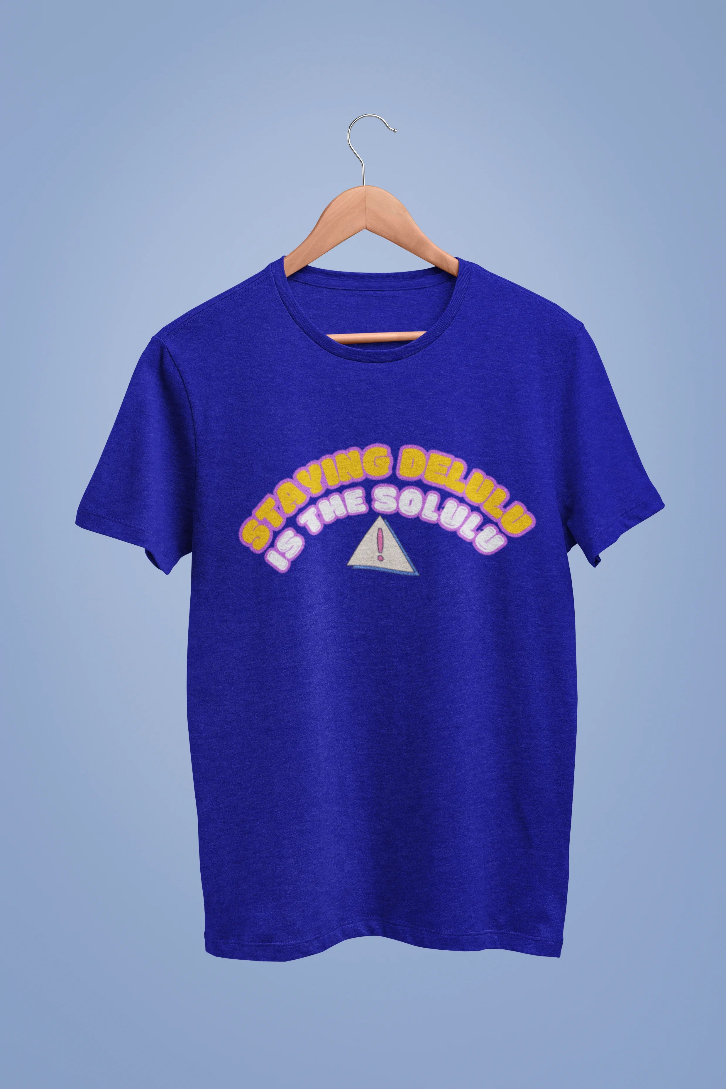 View of a royal blue oversized t-shirt with the hilarious message "Stay Delulu" in a bold design. Ideal for those who love trendy slang and lighthearted humor.