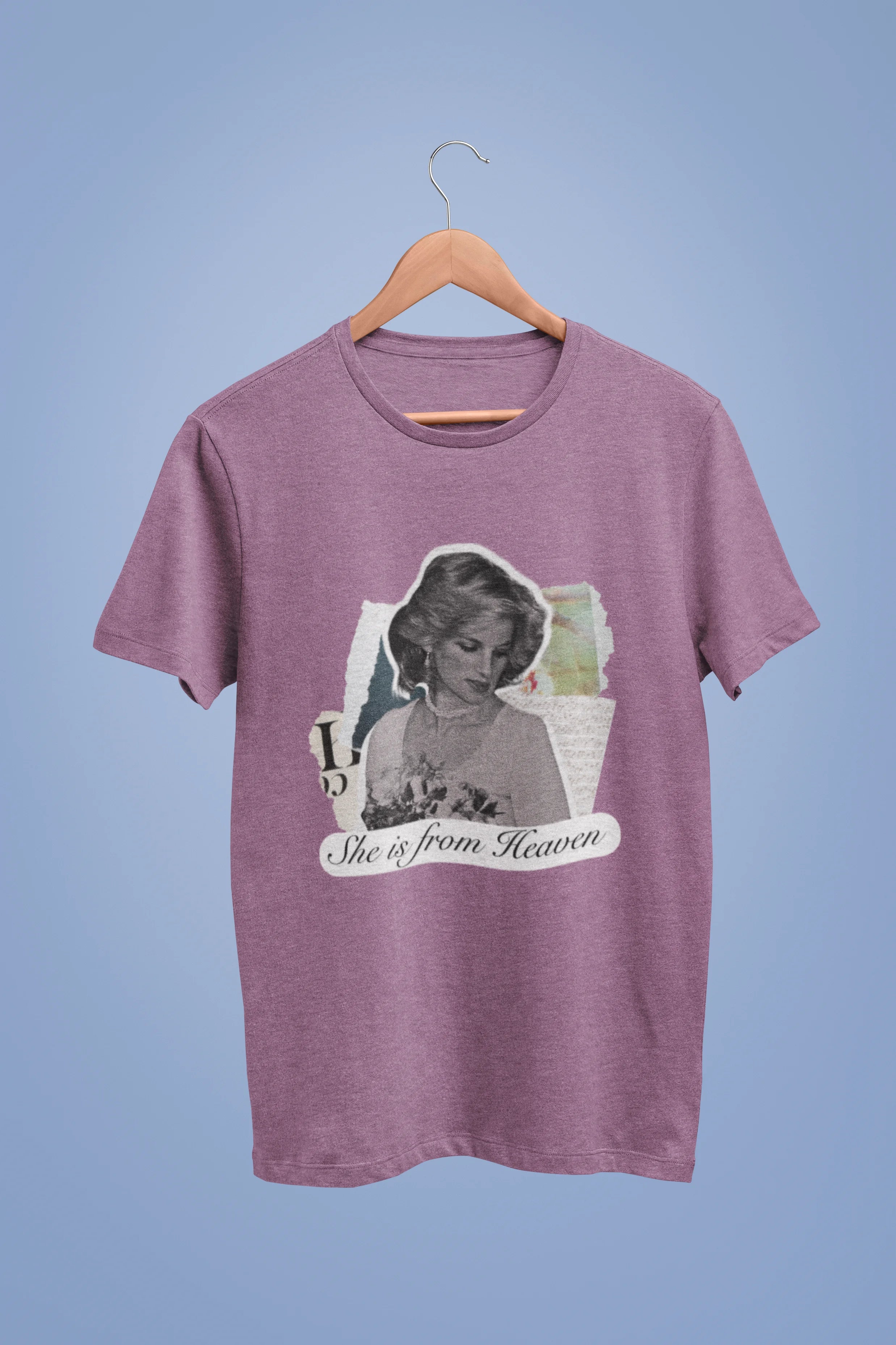 Front view of a dirty purple oversized t-shirt featuring a black and white photo of Princess Diana with the text "She is from Heaven." Ideal for fans of Princess Diana and those who want to celebrate a royal icon.