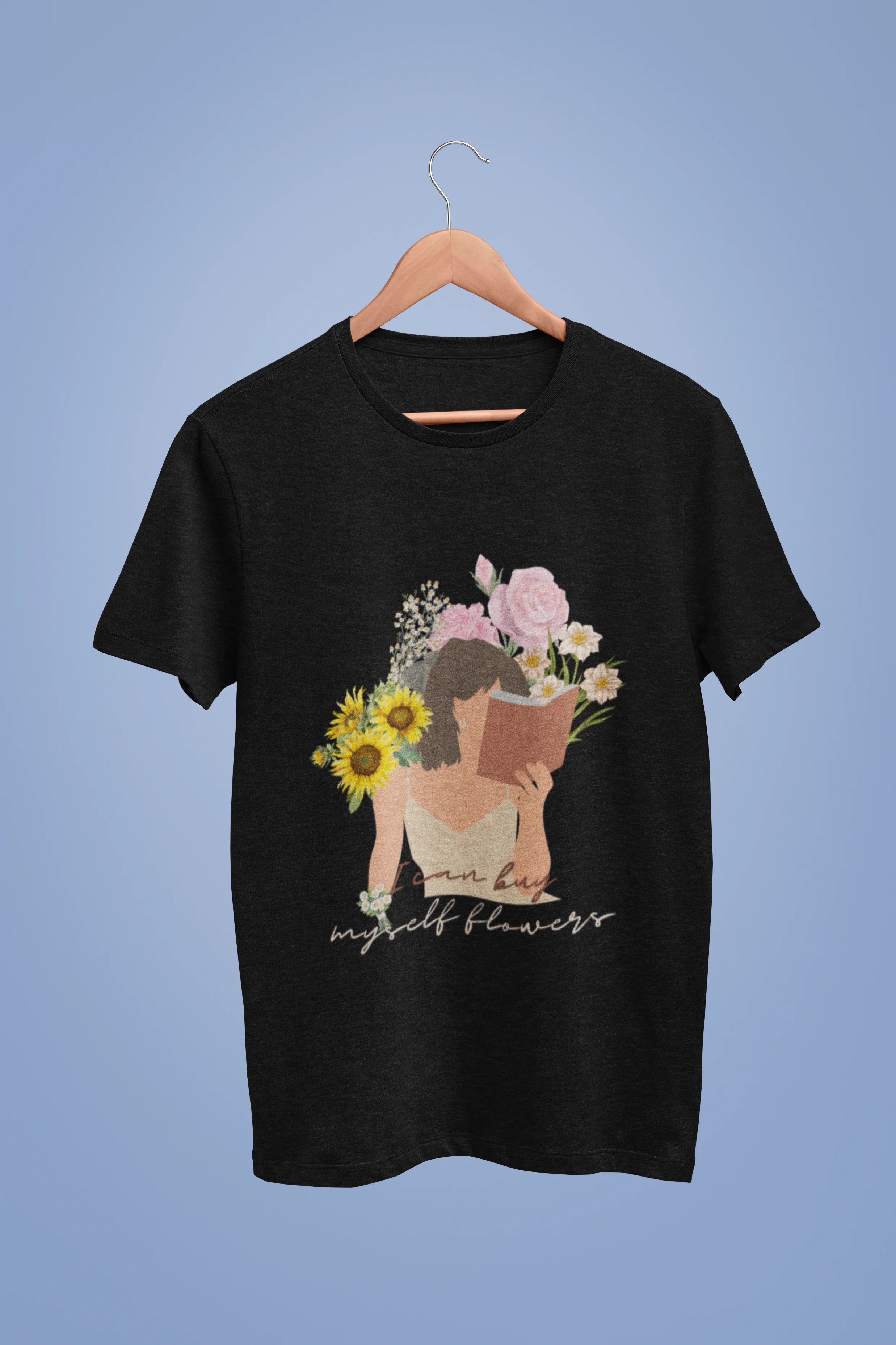 A black oversized t-shirt with a positive message "Buy Myself Flowers" and a graphic of a smiling woman surrounded by tulips and sunflowers. Ideal for those who love inspirational clothing and floral designs.