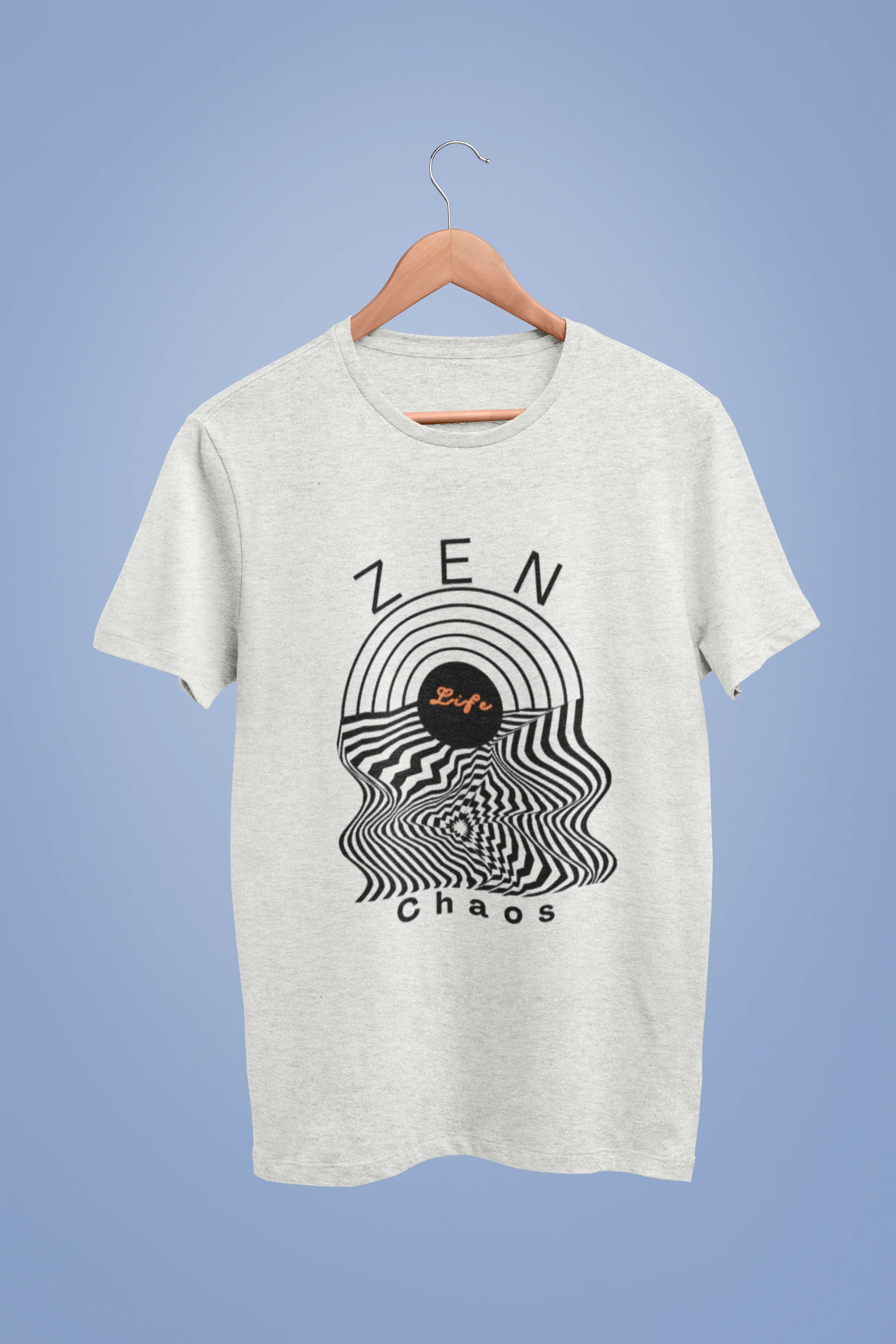 Front image of an off-white oversized t-shirt featuring an aesthetic design of a setting sun and crashing waves with the text "Zen & Chaos" above it. Ideal for those who love philosophical themes and visually striking clothing.