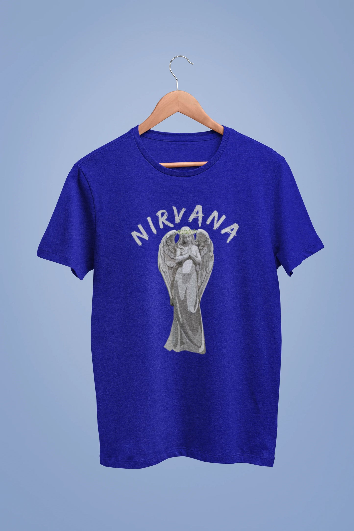 Front image of a royal blue oversized t-shirt featuring a design of a winged angel with the text "Nirvana" above it. Ideal for fans of Nirvana and those who love grunge aesthetics.