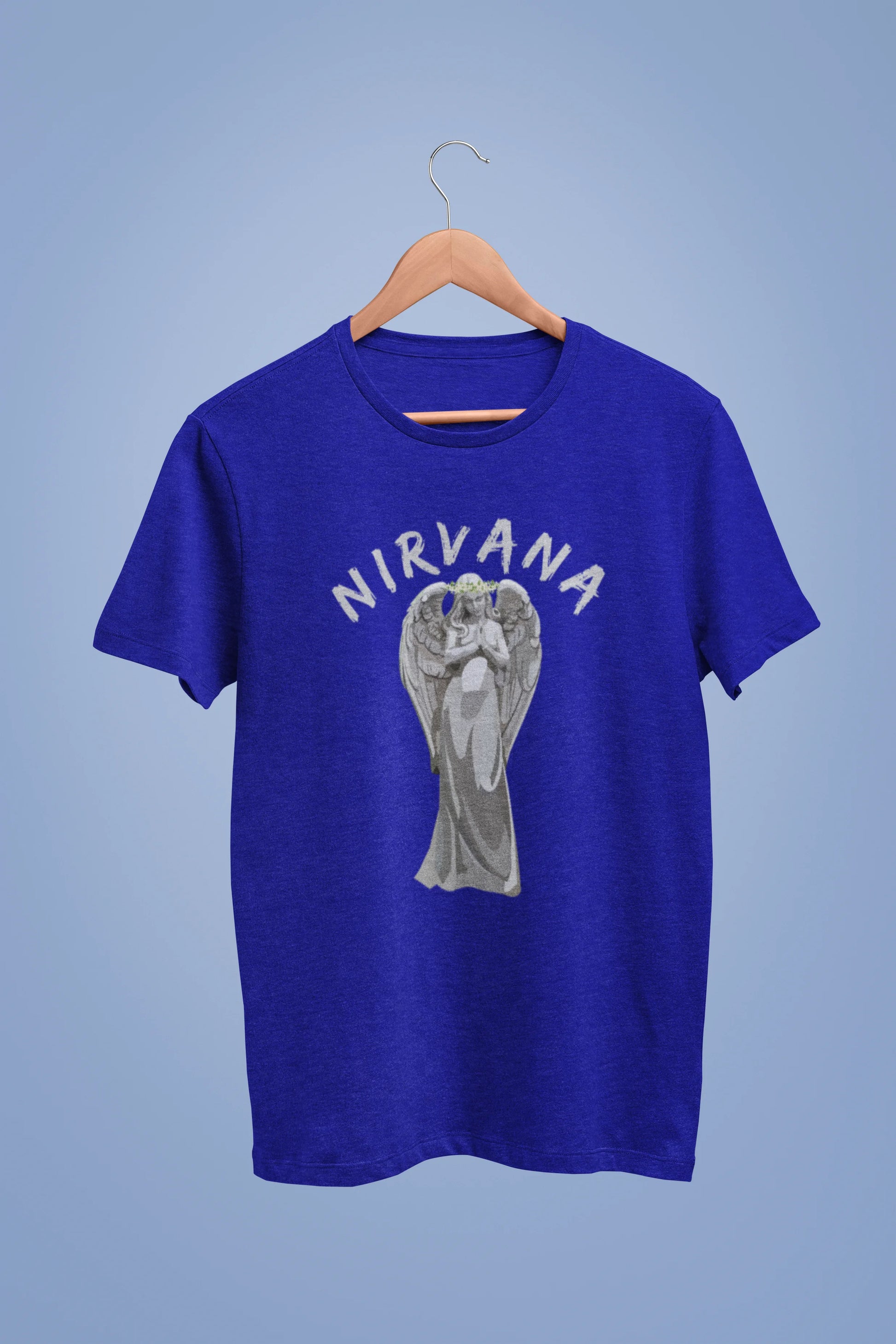 Front image of a royal blue oversized t-shirt featuring a design of a winged angel with the text "Nirvana" above it. Ideal for fans of Nirvana and those who love grunge aesthetics.