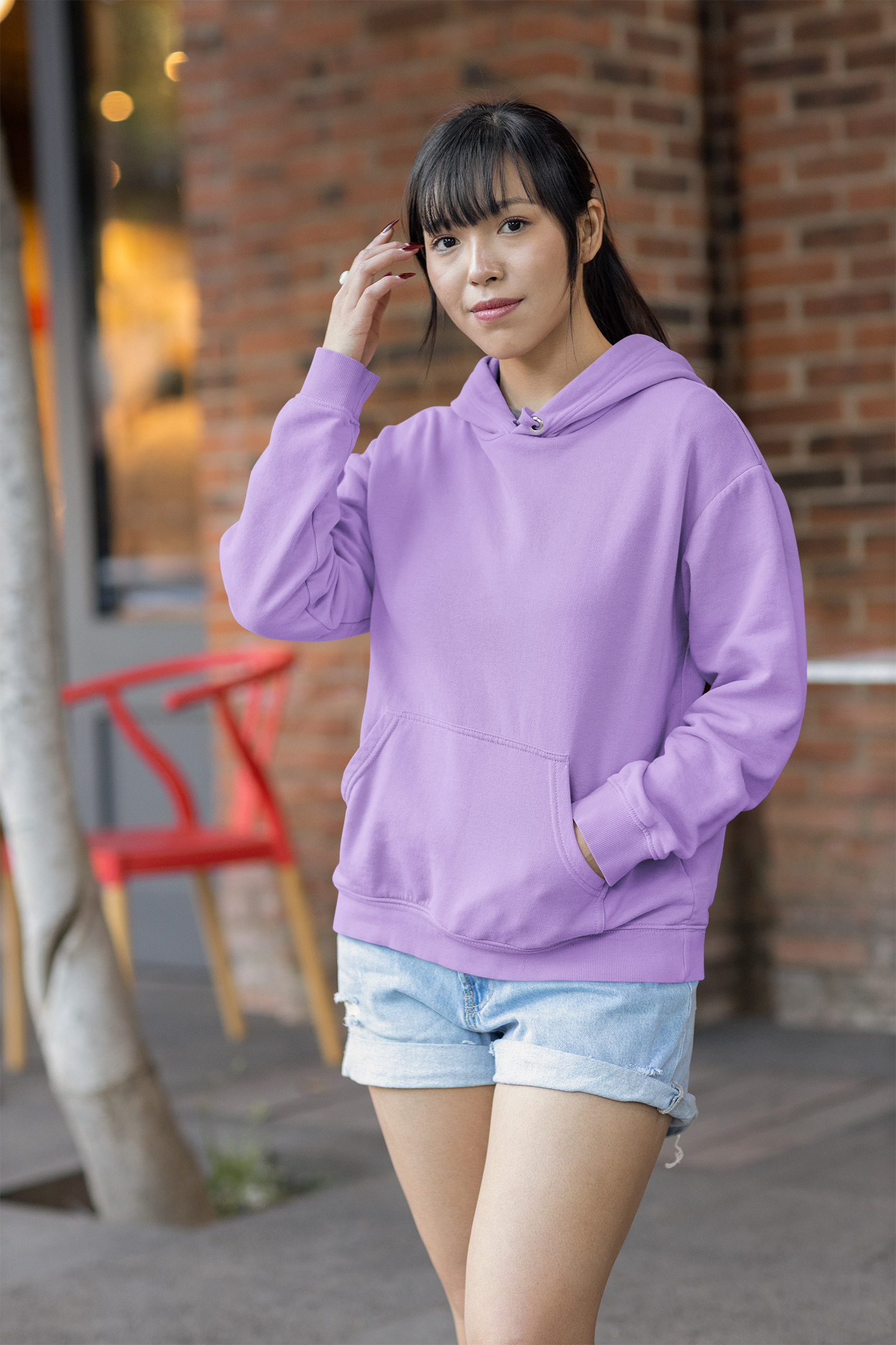 Front view of a female model wearing a lavender premium quality, pure cotton hoodie.