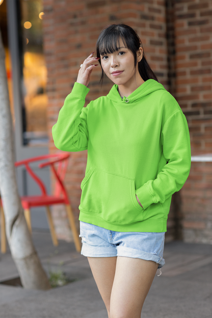 Front view of a female model wearing a parrot green premium quality, pure cotton hoodie.