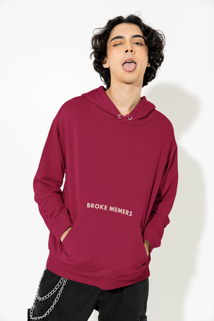Front view of a male model wearing a maroon hoodie with a Disney design featuring a muscular duck and the text "The Honk."