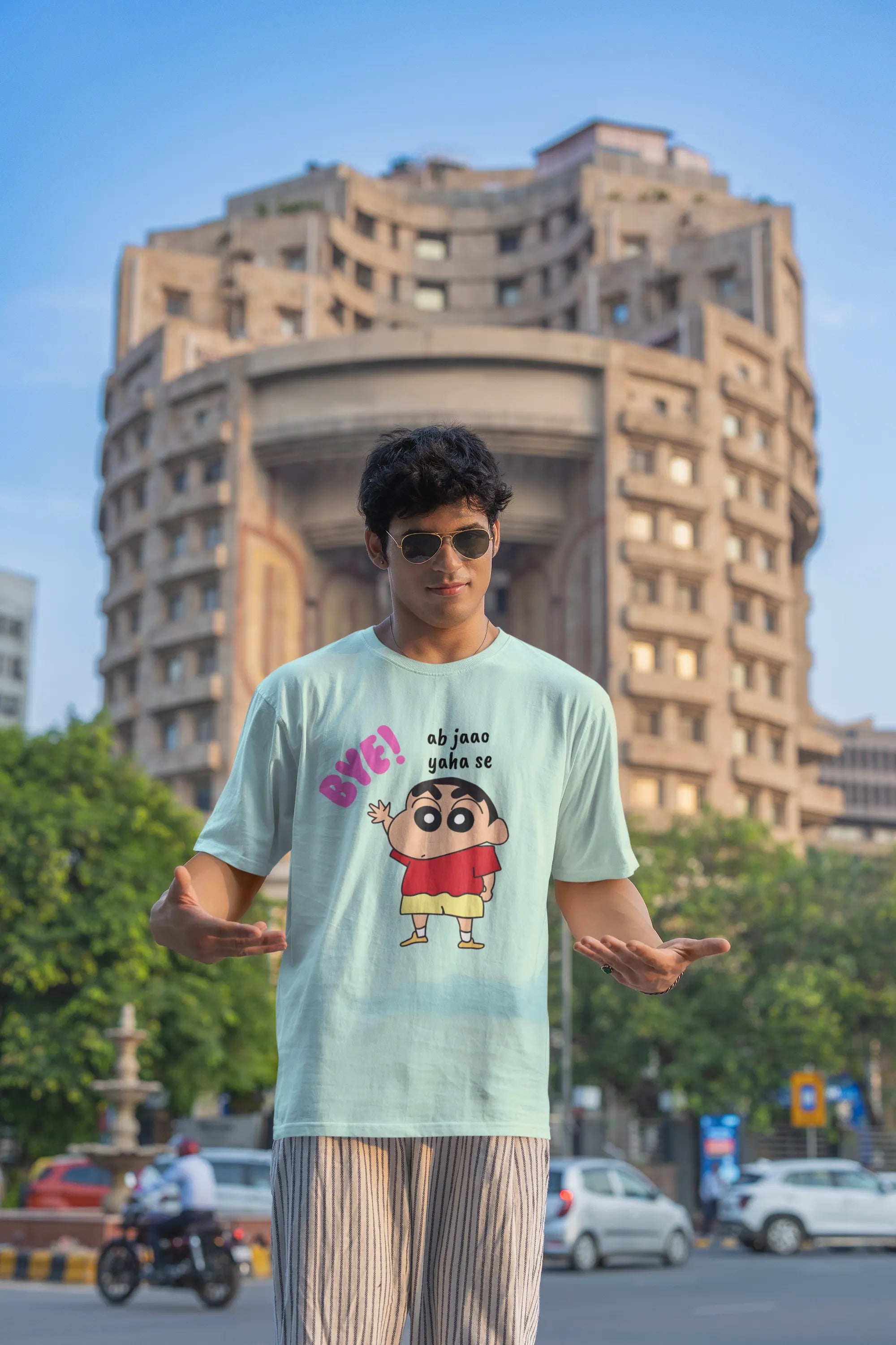 Third front view of an male model wearing an mintgreen  oversized tee featuring Shinchan saying "Ab Jhao" in Hindi. A perfect blend of humor and nostalgia for Shinchan fans.