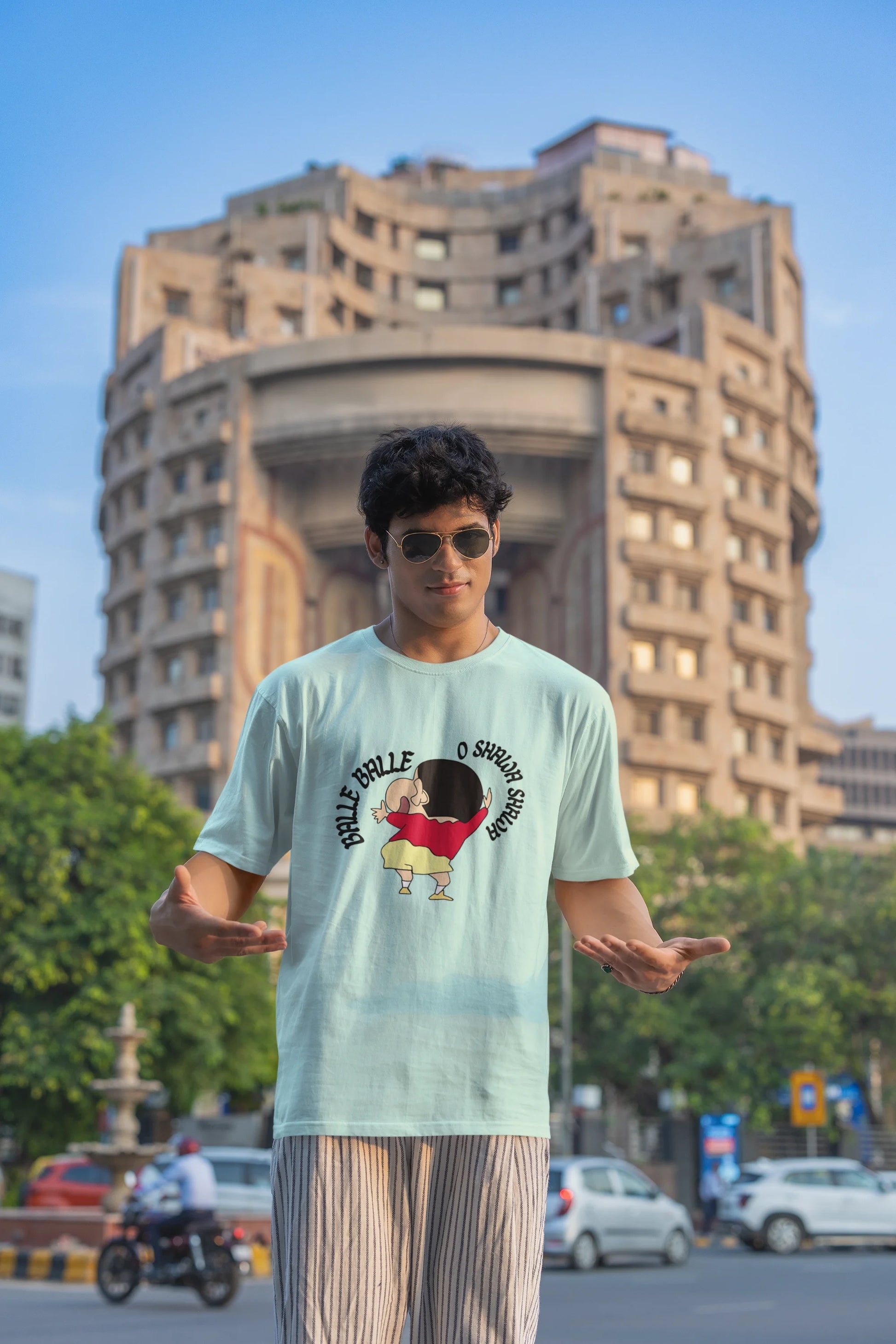 First front view of male model wearing an oversized mint green tee with Shinchan dancing and the text "Balle Balle". A perfect blend of anime and Bollywood for Shinchan fans.