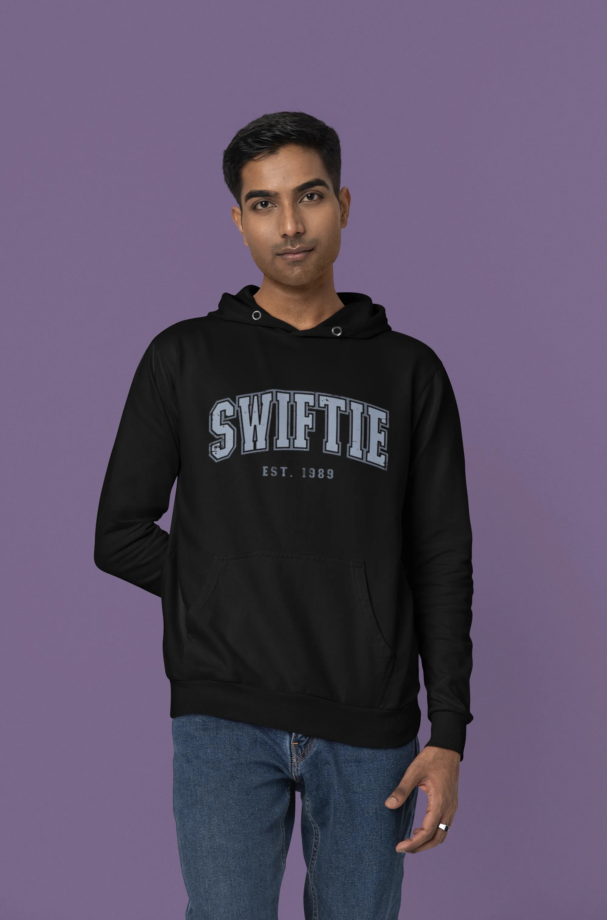 Third front view of a male Model wearing an black Swiftie hoodie, perfect for Taylor Swift fans and Eras Tour enthusiasts.