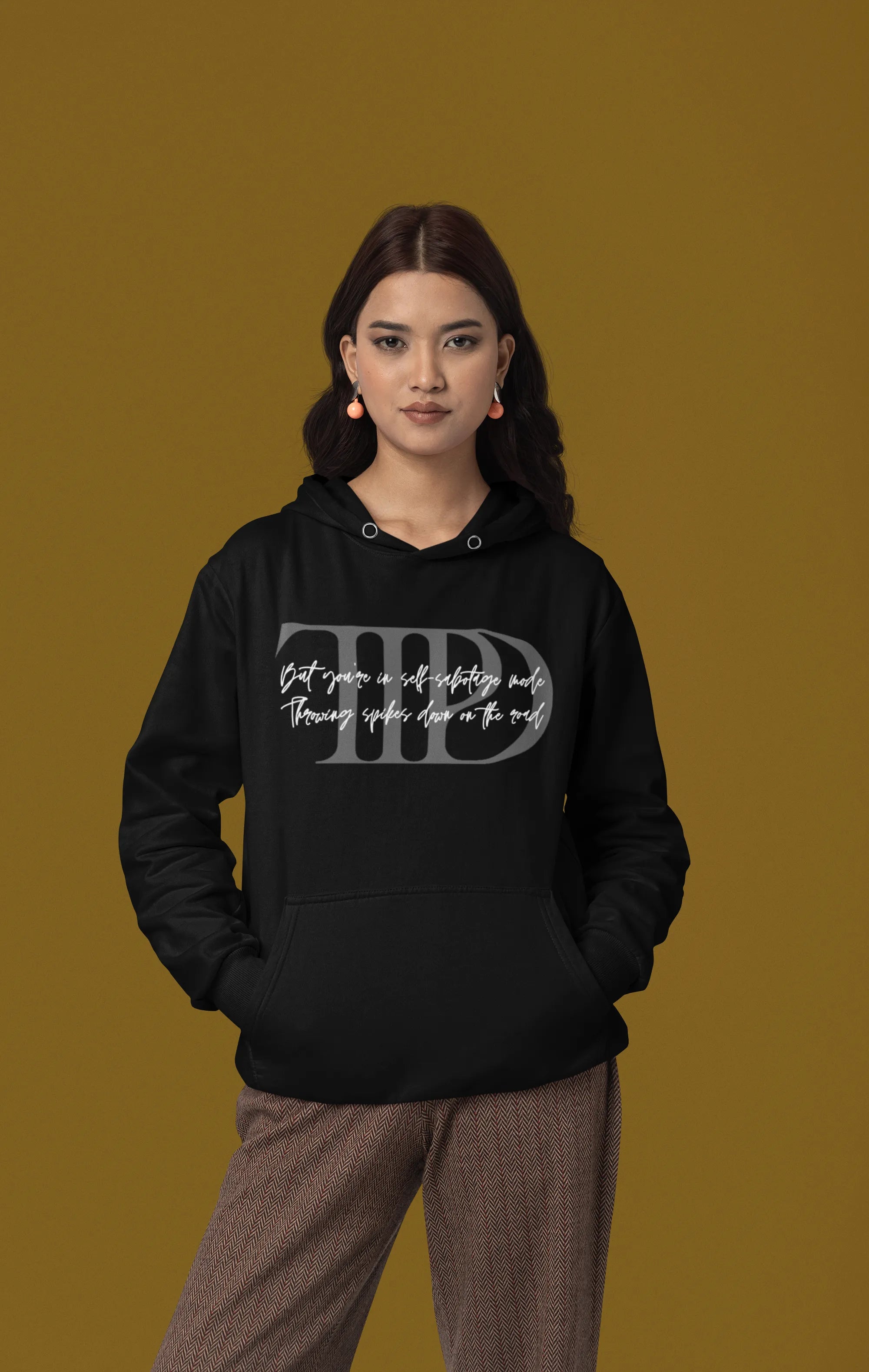 Second front view of a female model wearing a black oversized, cozy hoodie featuring "Lamenting" lyrics from Taylor Swift's TTPD era. Perfect for Swifties looking for comfortable Eras Tour merch.