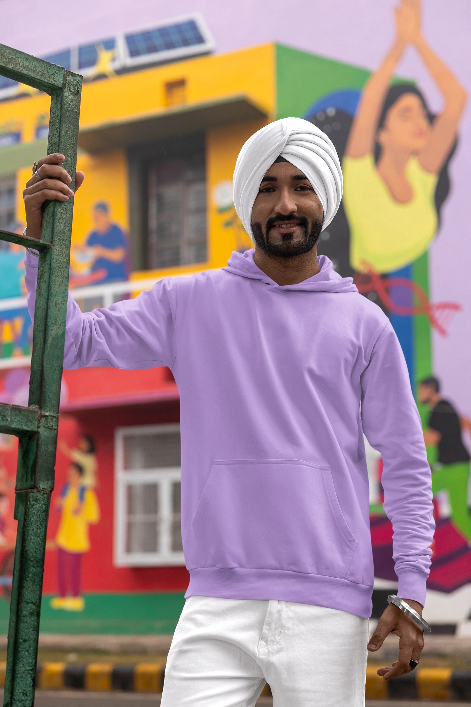 Second front view of a male model wearing a comfortable dirty purple hoodie featuring the phrase "Vibe Teri Meri" in a modern font on a portrait of Diljit Singh holding up a sunflower, perfect for expressing your unique style and feeling the rhythm.