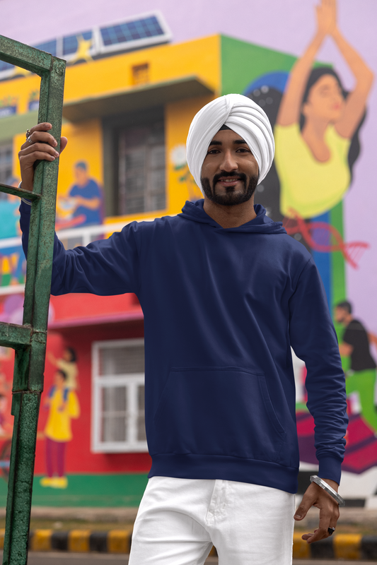 Front view of a male model wearing a royal blue hoodie with a Diljit Dosanjh album cover and song titles.