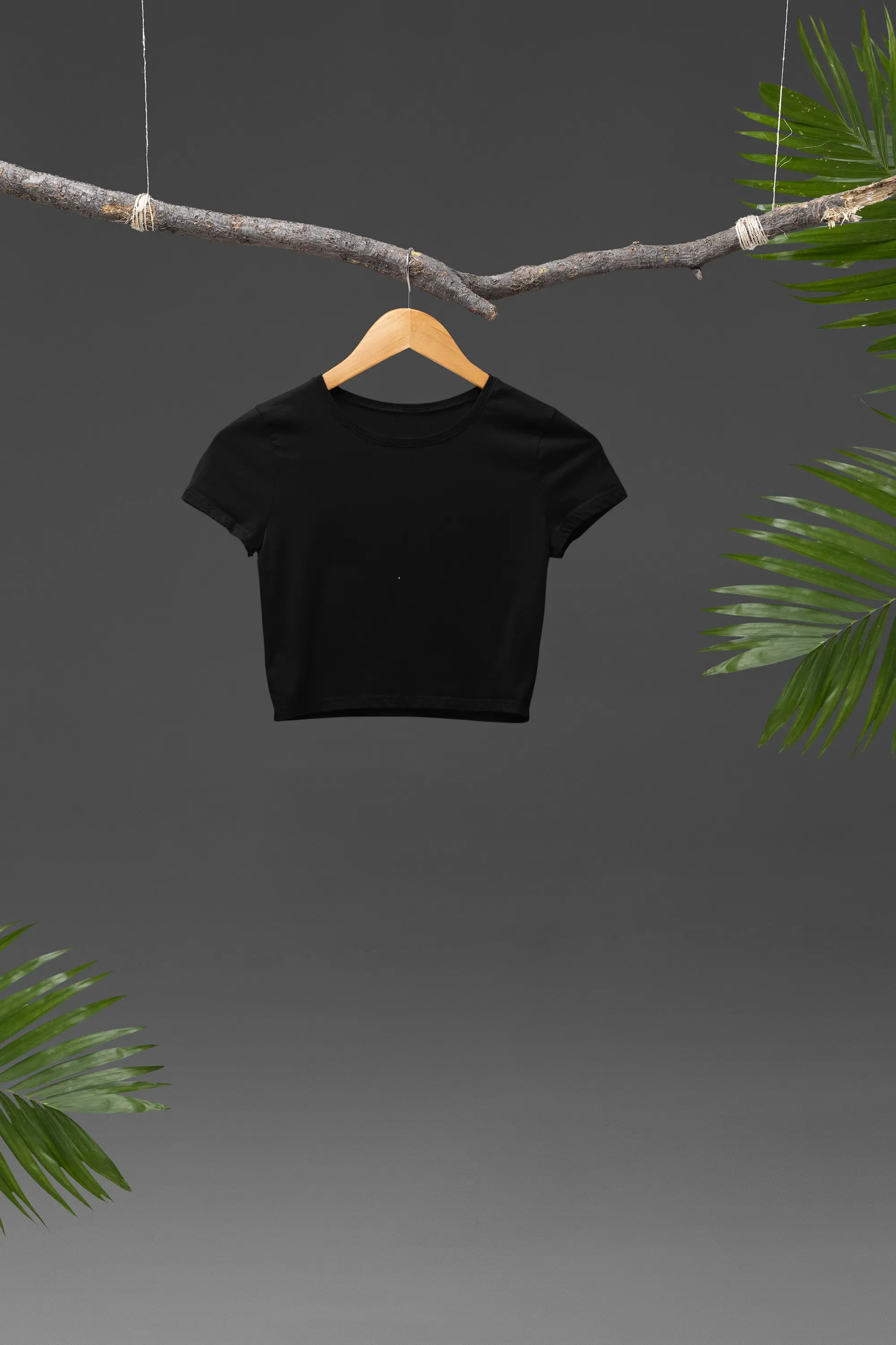 Front view of a stylish black crop top, exuding confidence and attitude.