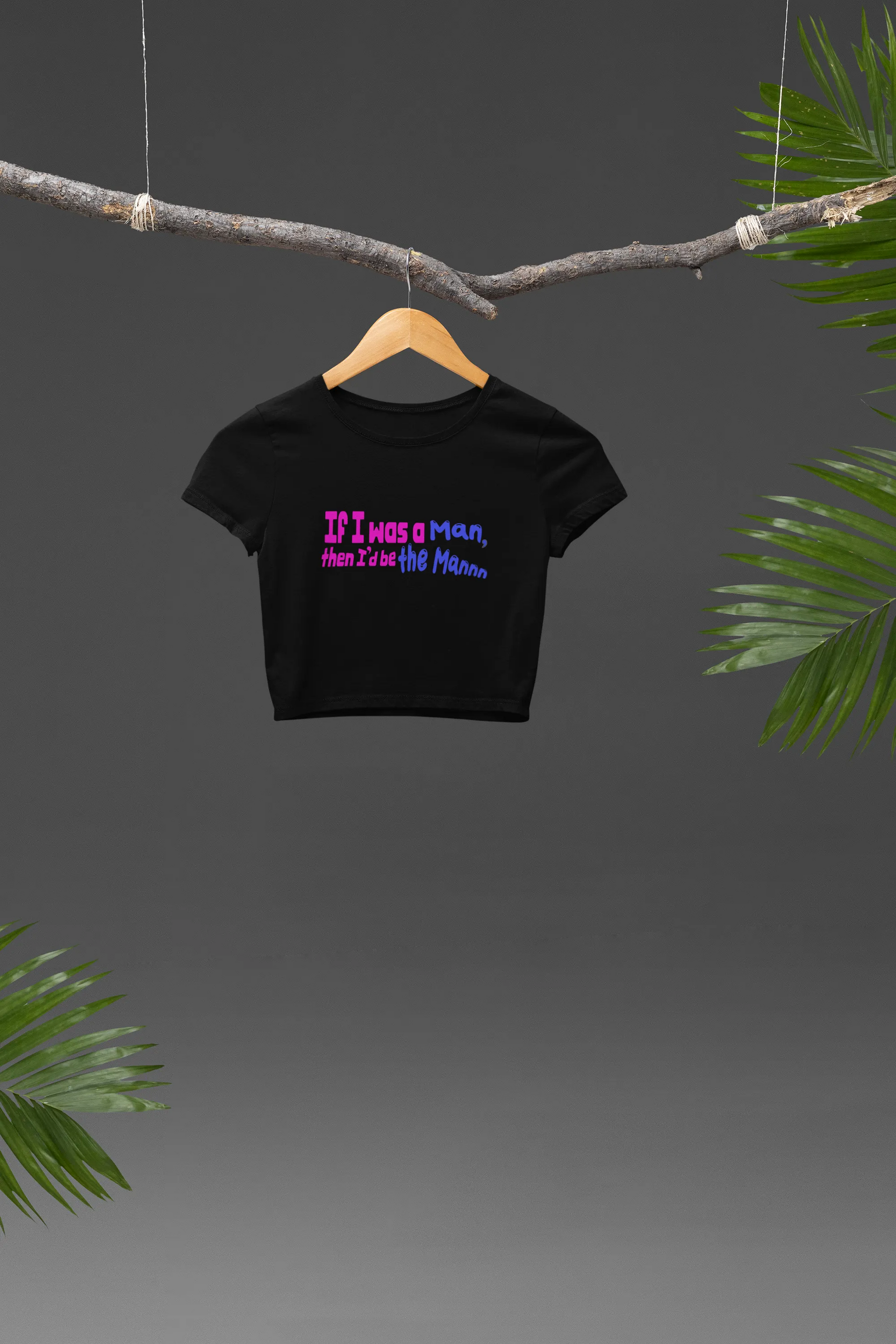 Front view of a black crop top with "I'd Be The Man" text, perfect for Swiftie fans.