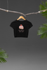 Front view of a stylish black crop top with a playful strawberry shortcake design, exuding confidence and personality.