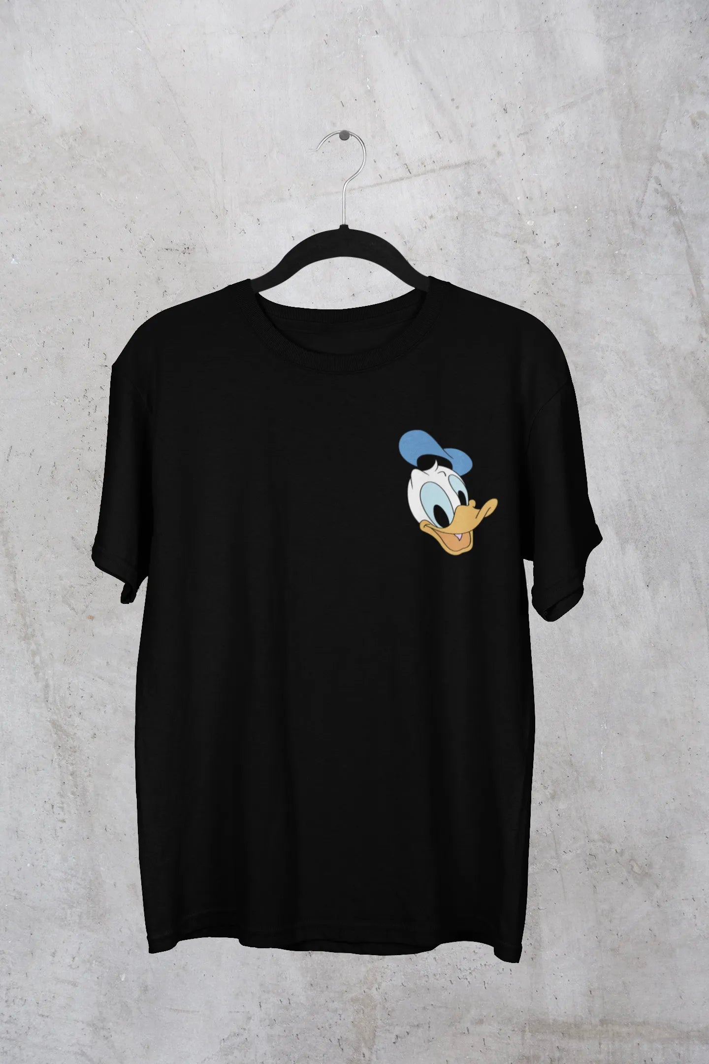 Front view of Black oversized Disney collection t-shirt featuring a classic Donald Duck design .