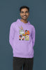 Third image of a male model wearing a lavender hoodie with a large Looney Tunes design. The illustration features portraits of several iconic Looney Tunes characters.