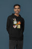 Third image of a male model wearing a black hoodie with a large Looney Tunes design. The illustration features portraits of several iconic Looney Tunes characters.