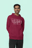 Third front view of a male model wearing a maroon oversized, cozy hoodie featuring 