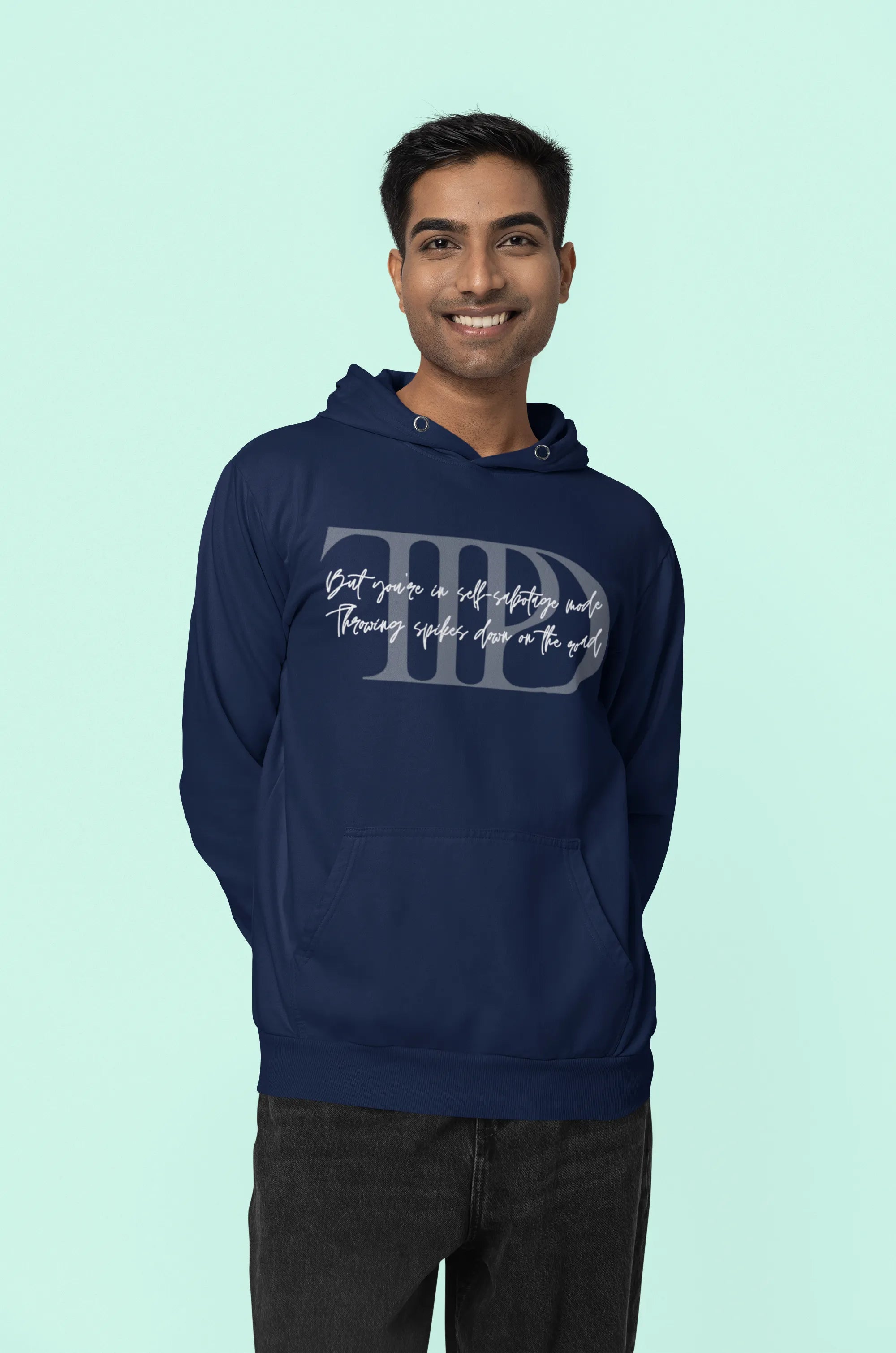 Third front view of a male model wearing a navy blue oversized, cozy hoodie featuring "Lamenting" lyrics from Taylor Swift's TTPD era. Perfect for Swifties looking for comfortable Eras Tour merch.