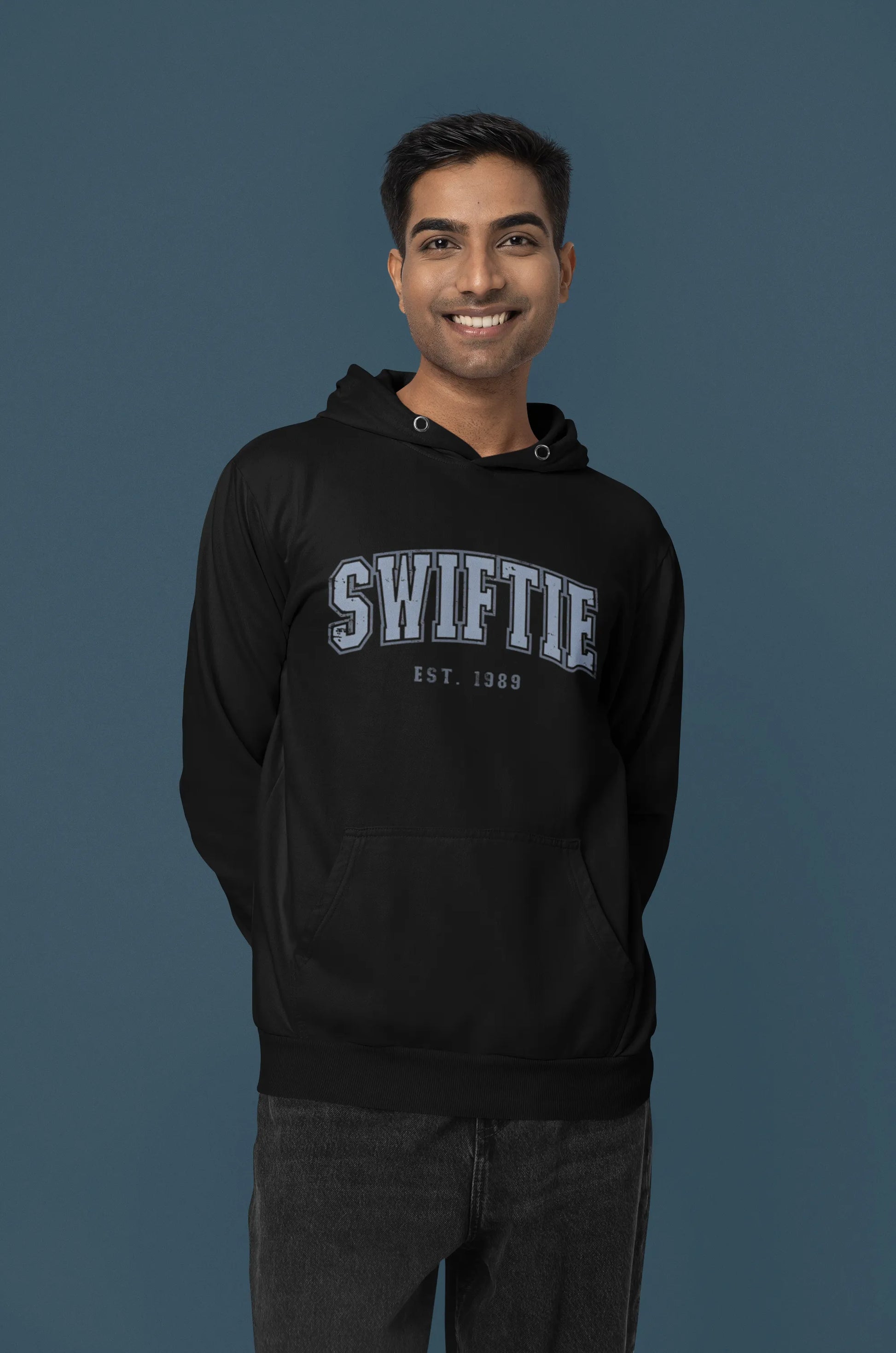 Second front view of a male Model wearing an black Swiftie hoodie, perfect for Taylor Swift fans and Eras Tour enthusiasts.