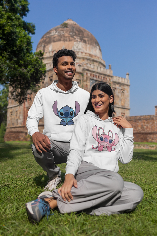 First front view of a couple wearing matching white hoodies, one with a Stitch design and the other with an Angel design.
