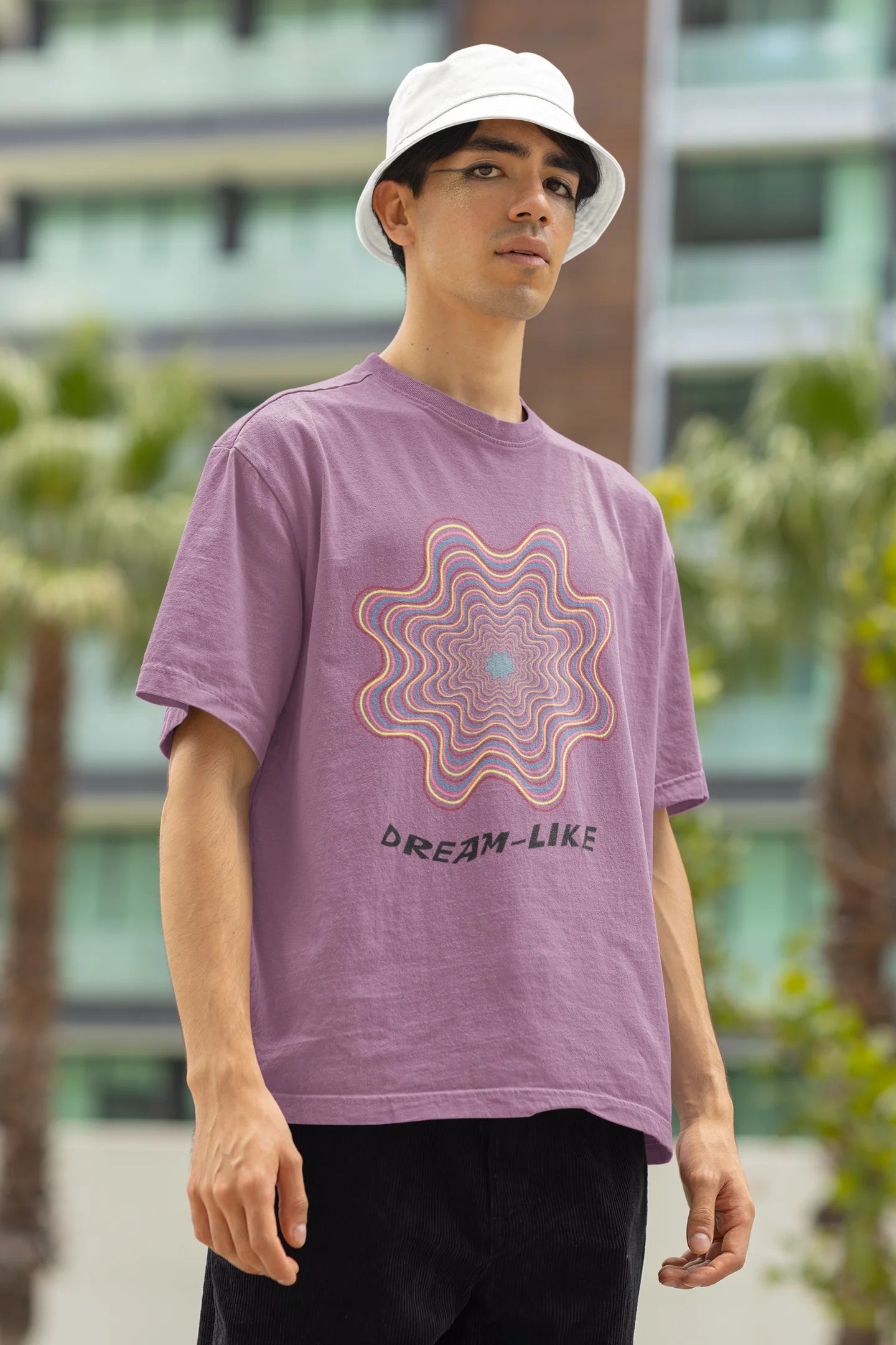 Left side view of a male model wearing an dirty purple oversized t-shirt with a dreamlike spiderweb design made of frequencies, offering a visually captivating and relaxing aesthetic.
