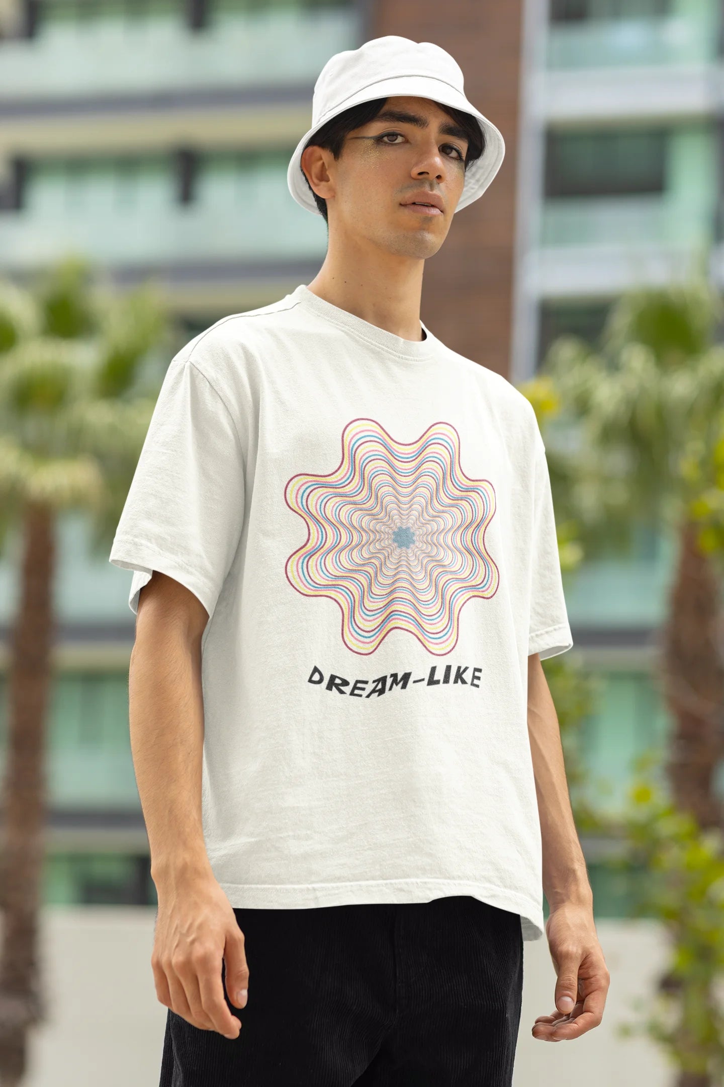 Left side view of male model wearing an off-white Oversized t-shirt with a dreamlike spiderweb design made of frequencies, offering a visually captivating and relaxing aesthetic.