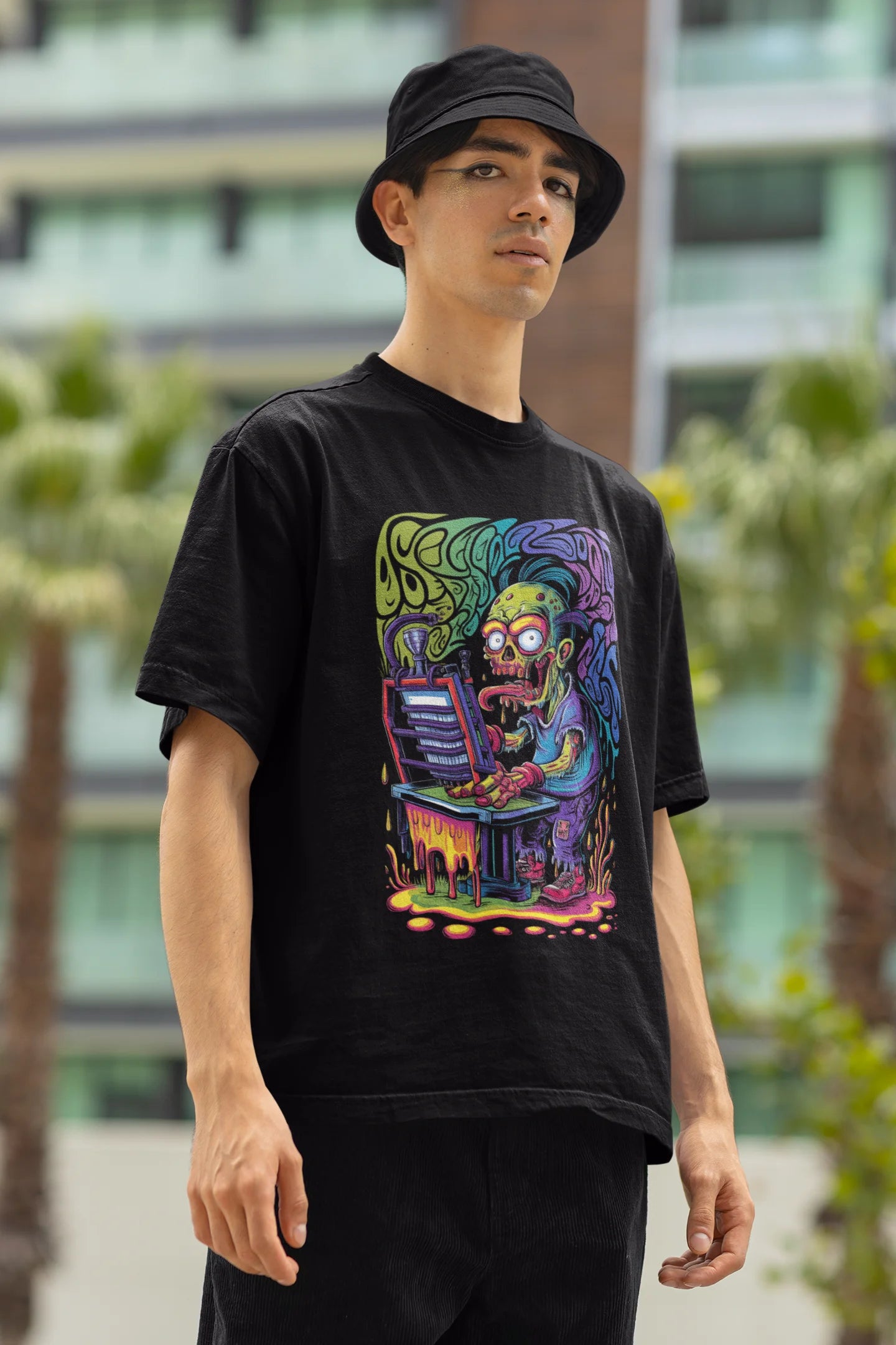 Left side view of a male model wearing an black oversized t-shirt featuring a psychedelic melting green zombie design, perfect for a trippy, dark aesthetic.