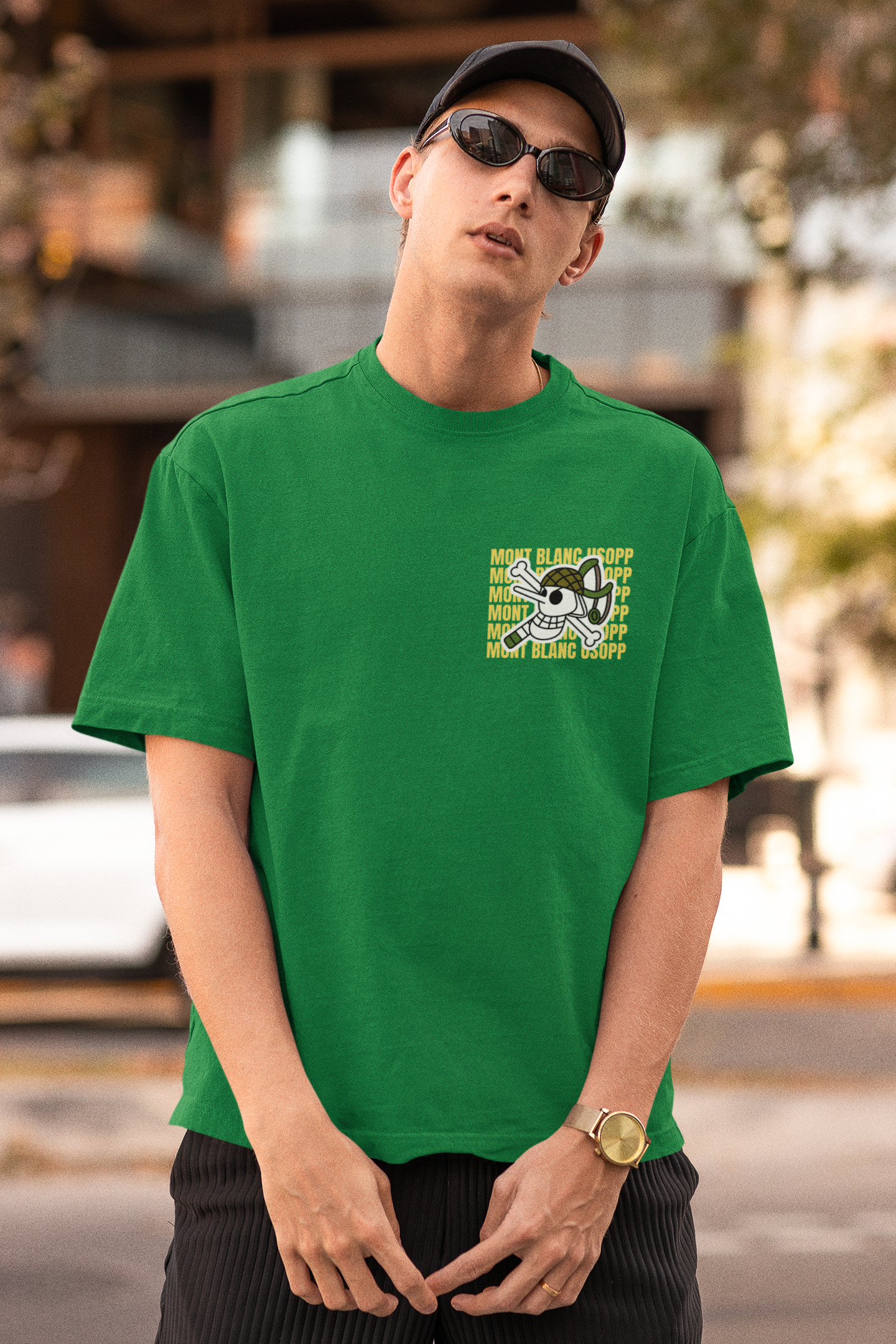 First front view of a male model wearing a forest green oversized t-shirt featuring Usopp from the One Piece anime.