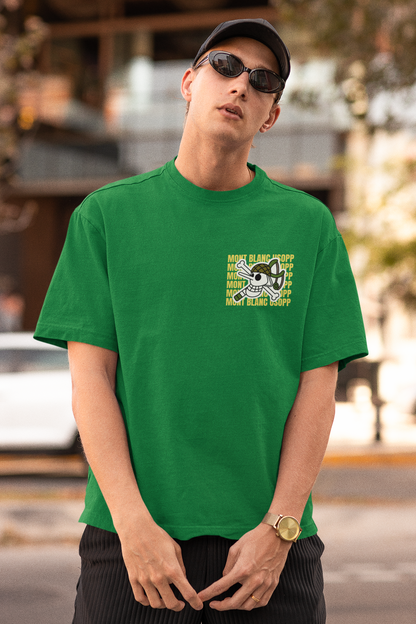 First front view of a male model wearing a forest green oversized t-shirt featuring Usopp from the One Piece anime.