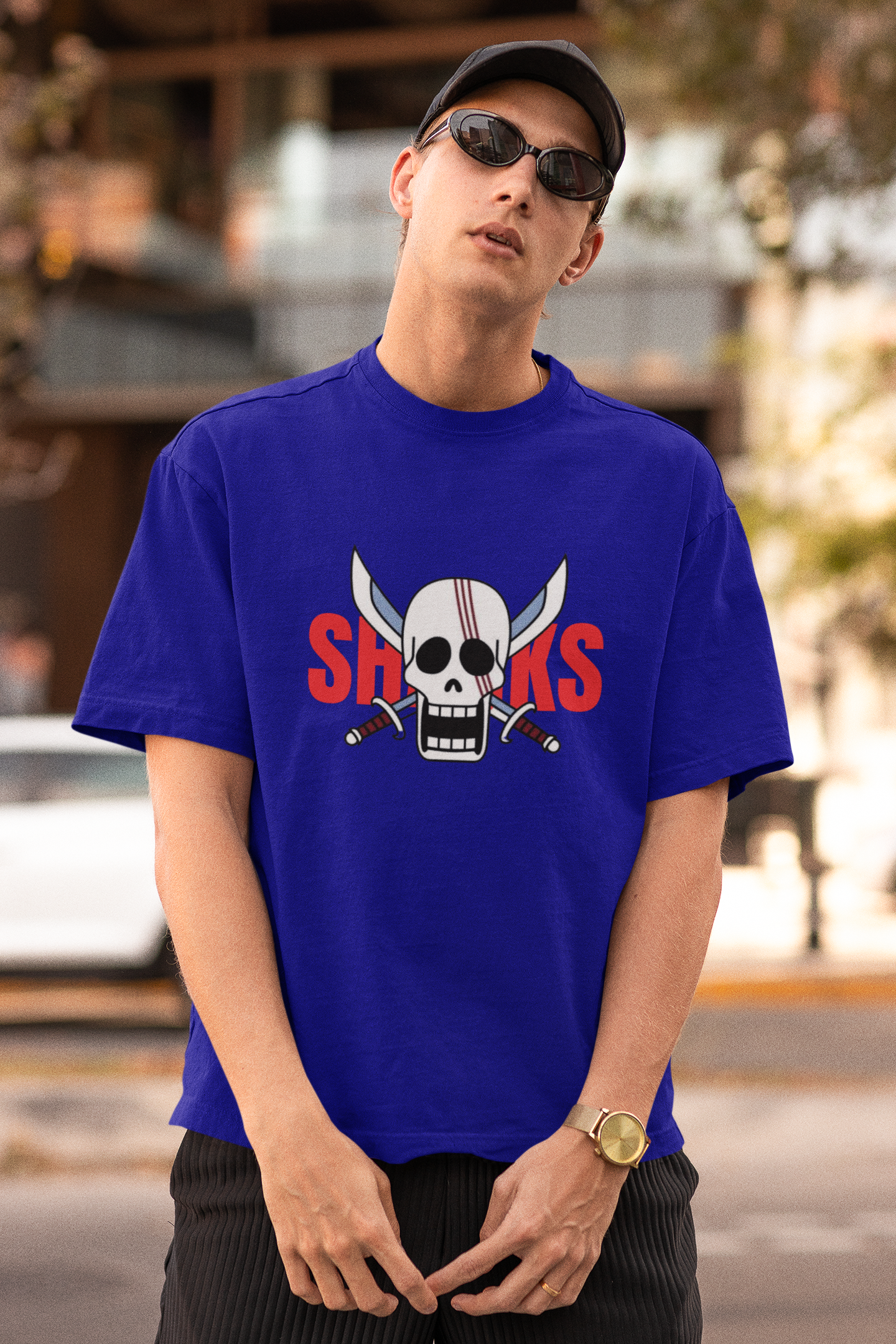 First front view of a male model wearing a royal blue oversized t-shirt featuring Red-Haired Shanks from the One Piece anime.