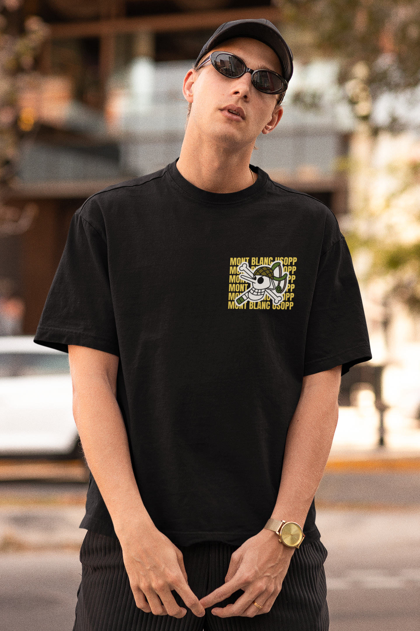 2nd front view of a male model wearing a black oversized t-shirt featuring Usopp from the One Piece anime.