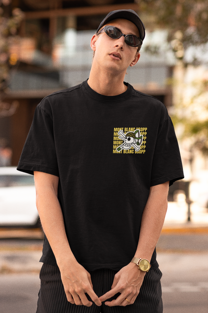 2nd front view of a male model wearing a black oversized t-shirt featuring Usopp from the One Piece anime.