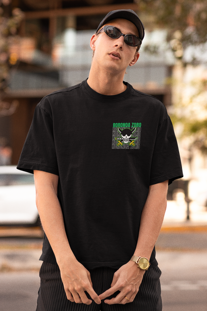 First front view of a male model wearing a black oversized t-shirt featuring Roronoa Zoro from the One Piece anime.