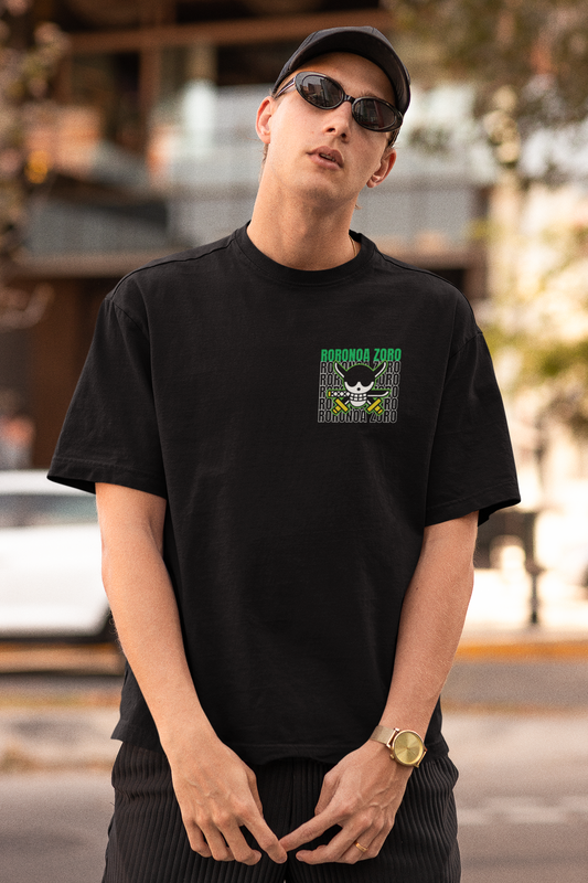 First front view of a male model wearing a black oversized t-shirt featuring Roronoa Zoro from the One Piece anime.