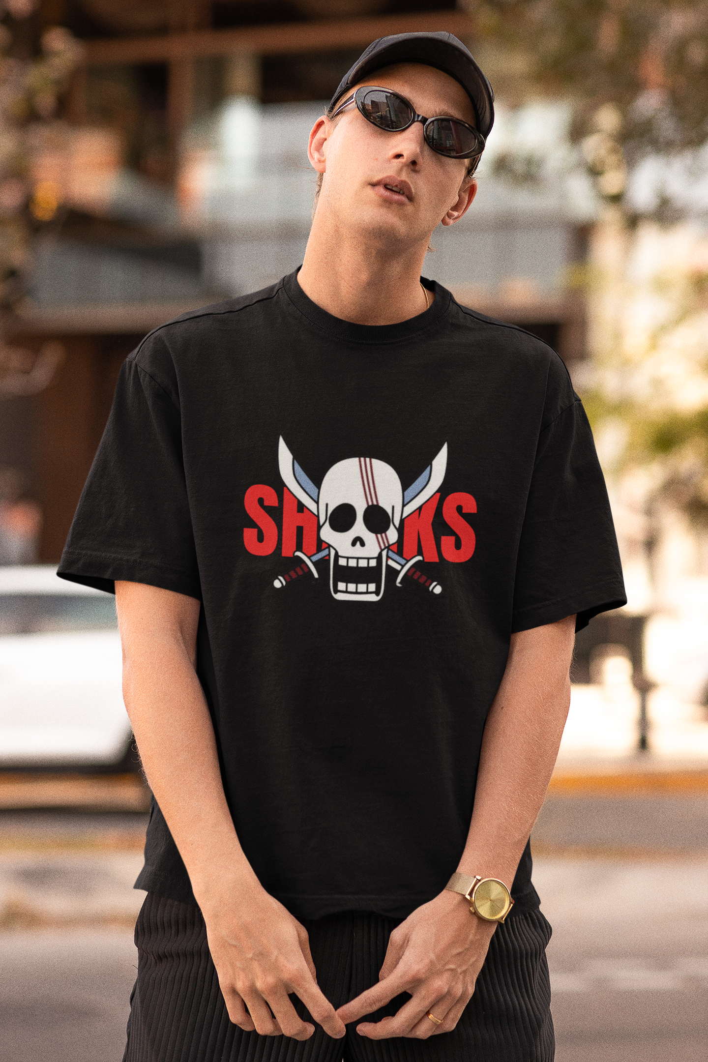 First front view of a male model wearing a black oversized t-shirt featuring Red-Haired Shanks from the One Piece anime.