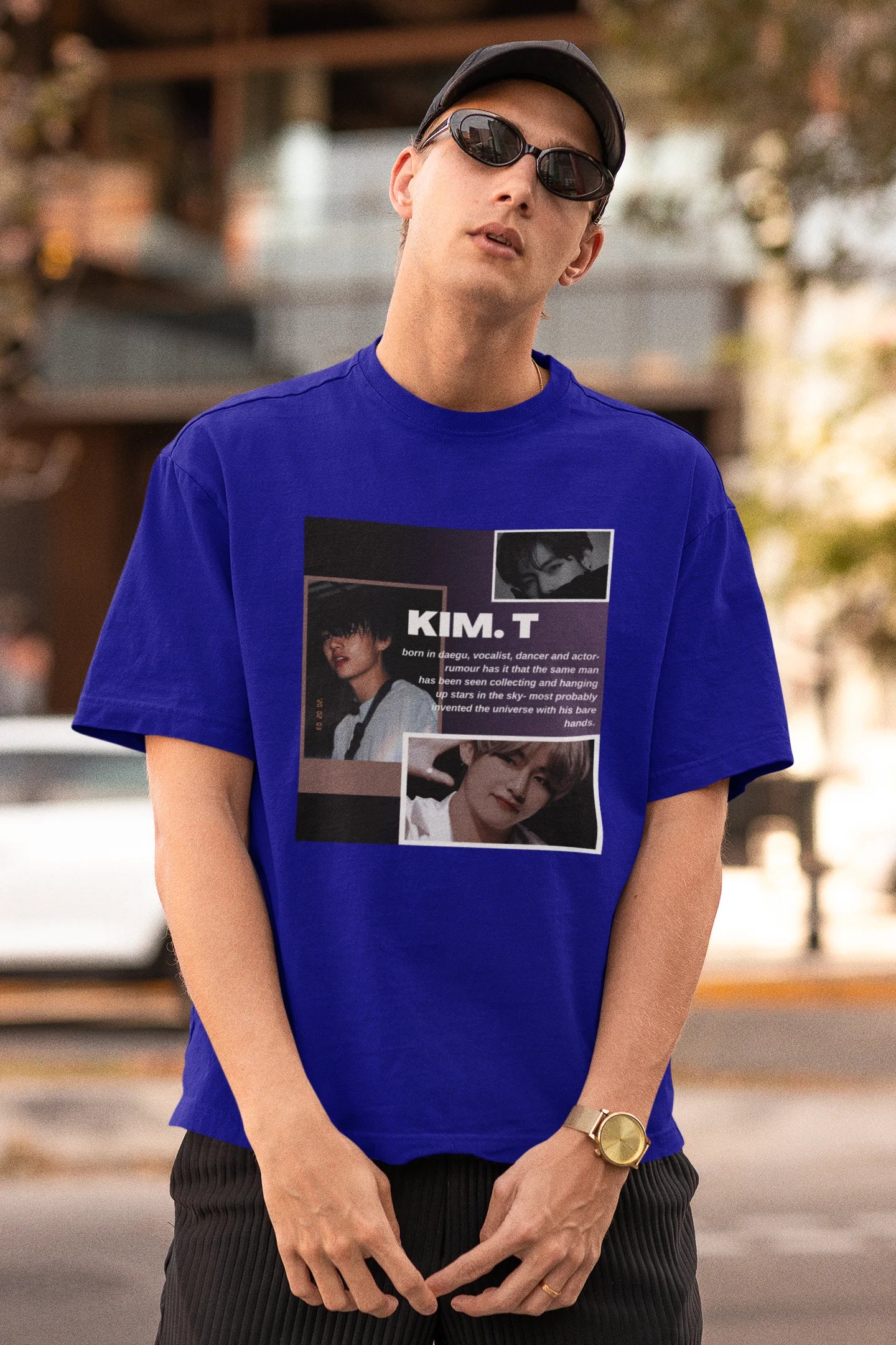 First front view of male model wearing a royal blue oversized t-shirt featuring a bold design inspired by BTS member Kim Taehyung (V). Ideal for BTS fans (ARMY) and K-Pop enthusiasts.