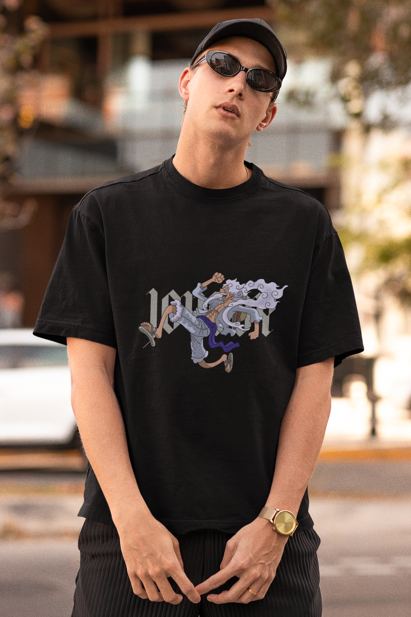 3rd front view of a male model wearing a black oversized t-shirt featuring Luffy in his Gear 5 form from the One Piece anime.