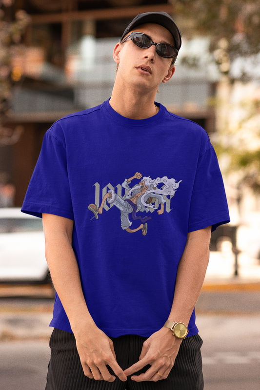First front view of a male model wearing a royal blue oversized t-shirt featuring Luffy in his Gear 5 form from the One Piece anime.