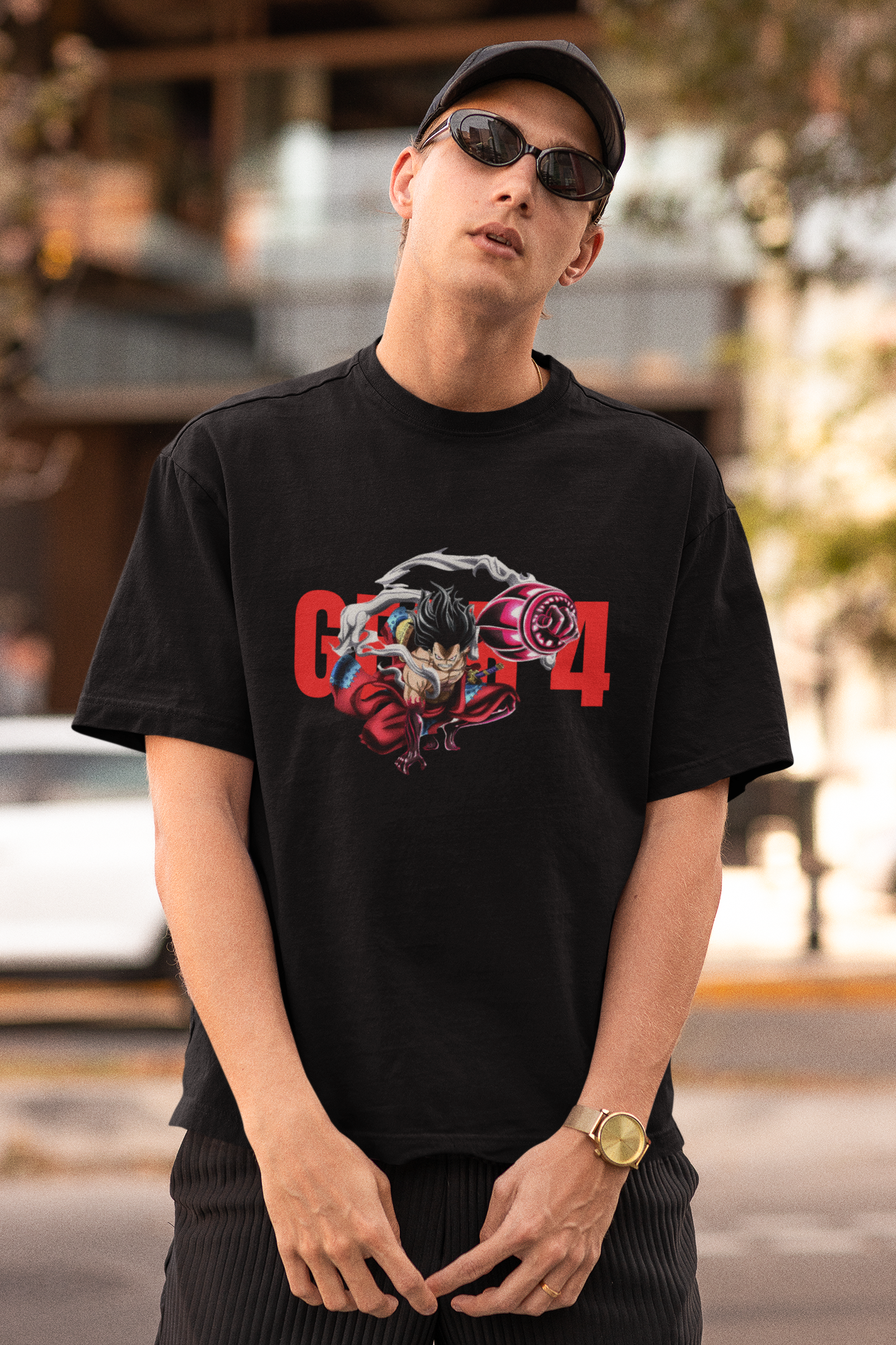 First front view of a male model wearing a black oversized t-shirt featuring Luffy in his Gear 4 Bounceman form from the One Piece anime.