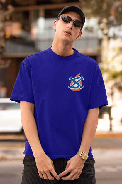 First front view of a male model wearing a royal blue oversized t-shirt featuring Sabo with the text "Flame Emperor."