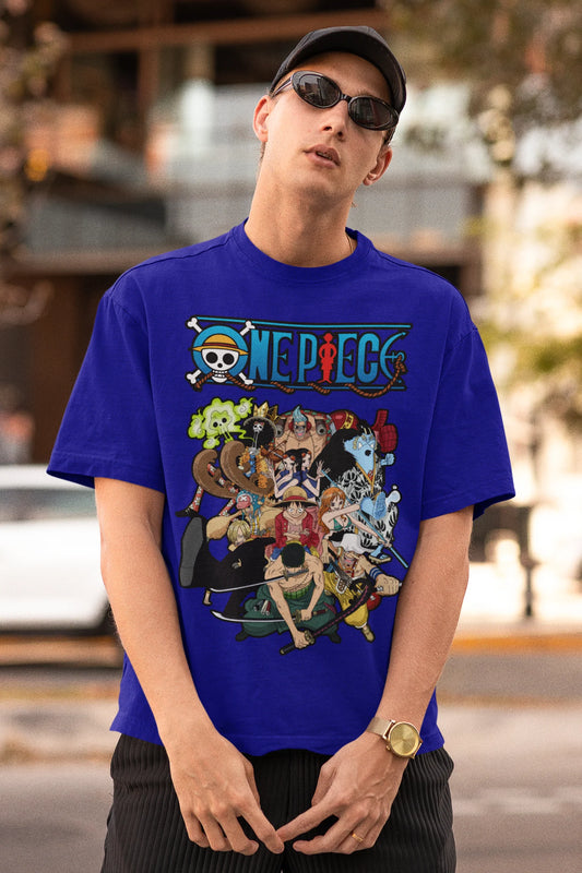 First front view of a male model wearing a royal blue oversized t-shirt featuring the entire Straw Hat Crew from the One Piece anime.