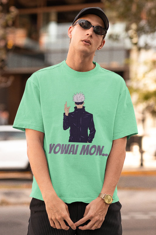First front view of a male model wearing a mint green oversized t-shirt featuring Gojo Satoru with his fingers crossed and the text "Yowai Mon."