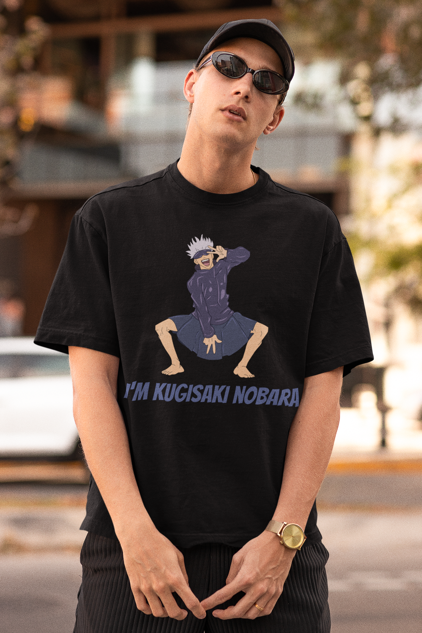 First front view of a male model wearing an black oversized t-shirt featuring Satoru Gojo dressed as Nobara Kugisaki.
