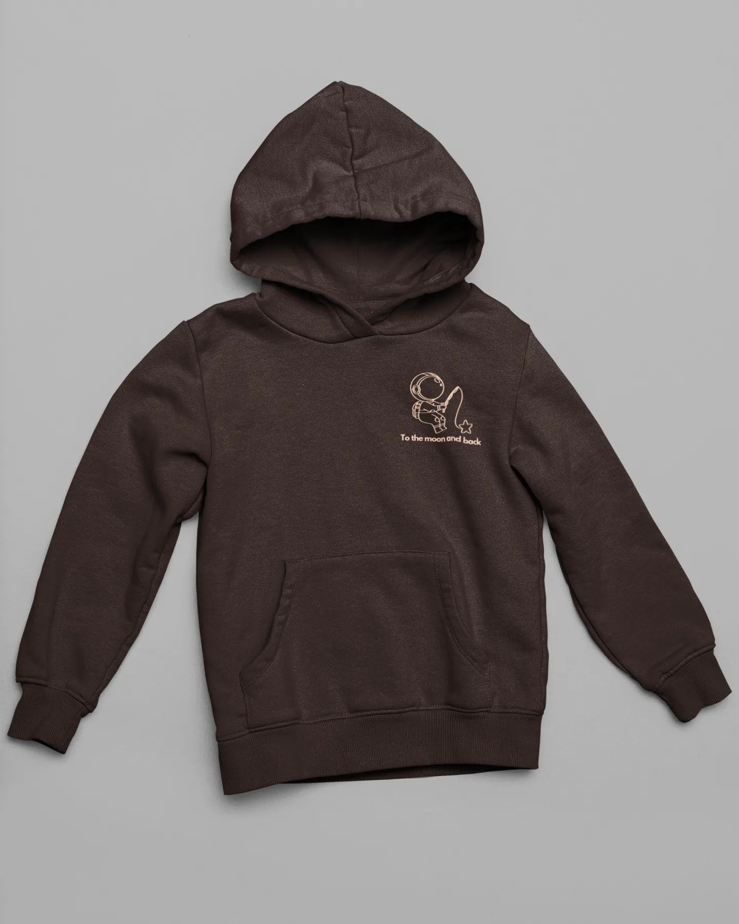 First front view of a matching chocolate brown hoodies, one with an astronaut design and the other with a planet design, along with the text "To the Moon and Back."